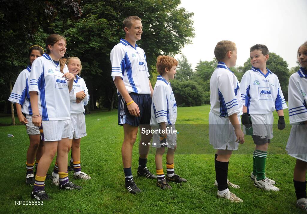 31 July 2008; The 9th annual MBNA Kick Fada competition was launched at Herbert Park, over 20 Inter-County Gaelic Football stars are set to compete for the prestigious All-Ireland title at the 2008 MBNA Kick Fada Final, which takes place on Saturday 13th at Bray Emmets GAA Club. Reigning champion John Brennan, from Carlow, will be back to defend his title after winning with a kick of 67 metres. At the launch is Dublin master free taker Tomas Quinn waiting in line for his turn with children from Kilmacud Crokes GAA club, Holy Trinity School Donaghmeade, and Bray Emmets GAA club. Herbert Park Hotel, Ballsbridge, Dublin Picture credit: Brian Lawless / SPORTSFILE