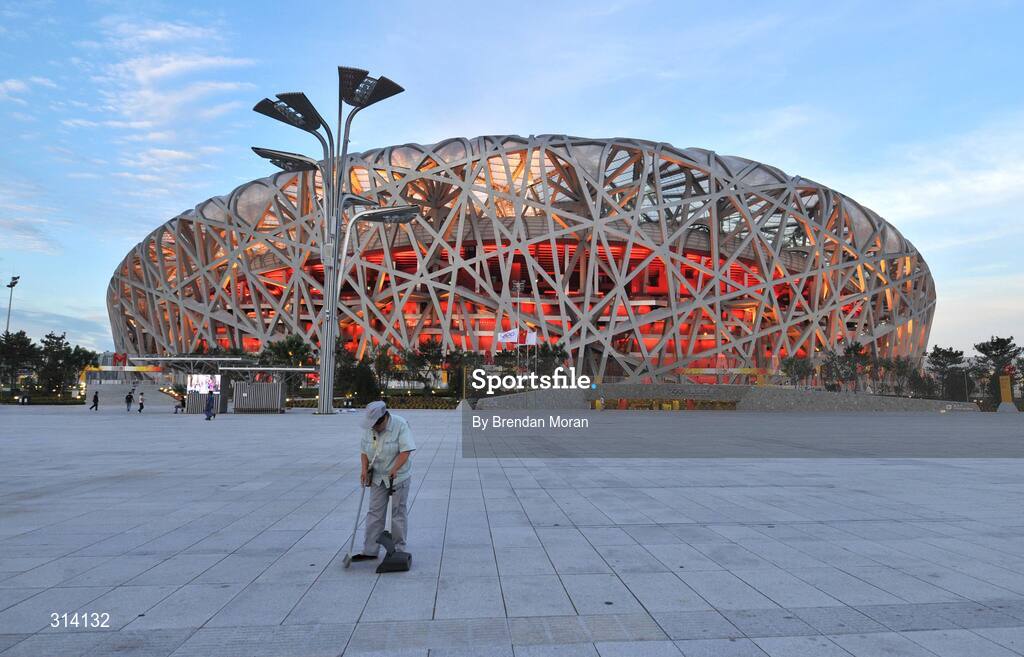 1 August 2008; A worker sweeps up in front the National Stadium as preparations continue ahead of the opening ceremony on Friday next, 8th of August. Beijing 2008 - Games of the XXIX Olympiad, National Stadium, Olympic Green, Beijing, China. Picture credit: Brendan Moran / SPORTSFILE