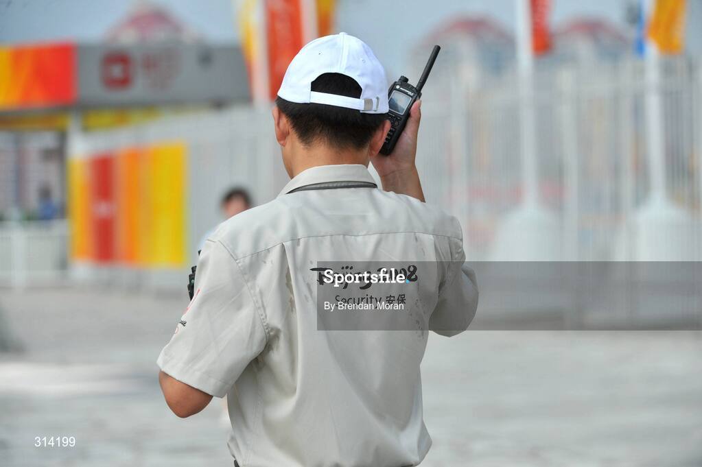 2 August 2008; A security guard listens on his radio as preparations continue ahead of the opening ceremony on Friday next, 8th of August. Beijing 2008 - Games of the XXIX Olympiad, Olympic Green, Beijing, China. Picture credit: Brendan Moran / SPORTSFILE
