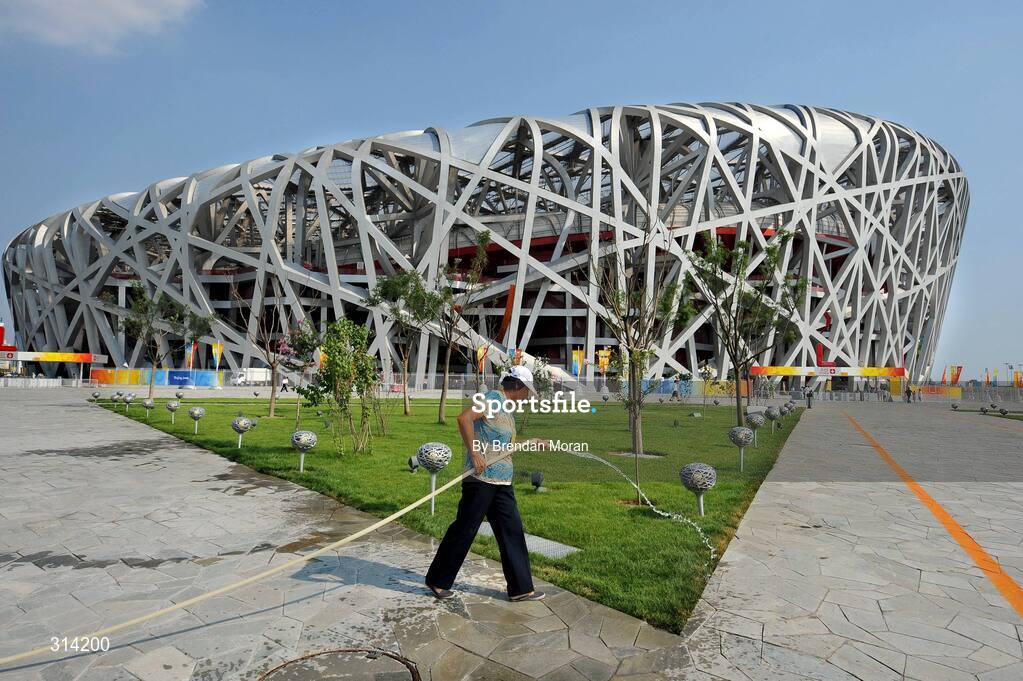 2 August 2008; A gardener waters the grass in front of the National Stadium as preparations continue ahead of the opening ceremony on Friday next, 8th of August. Beijing 2008 - Games of the XXIX Olympiad, Olympic Green, Beijing, China. Picture credit: Brendan Moran / SPORTSFILE