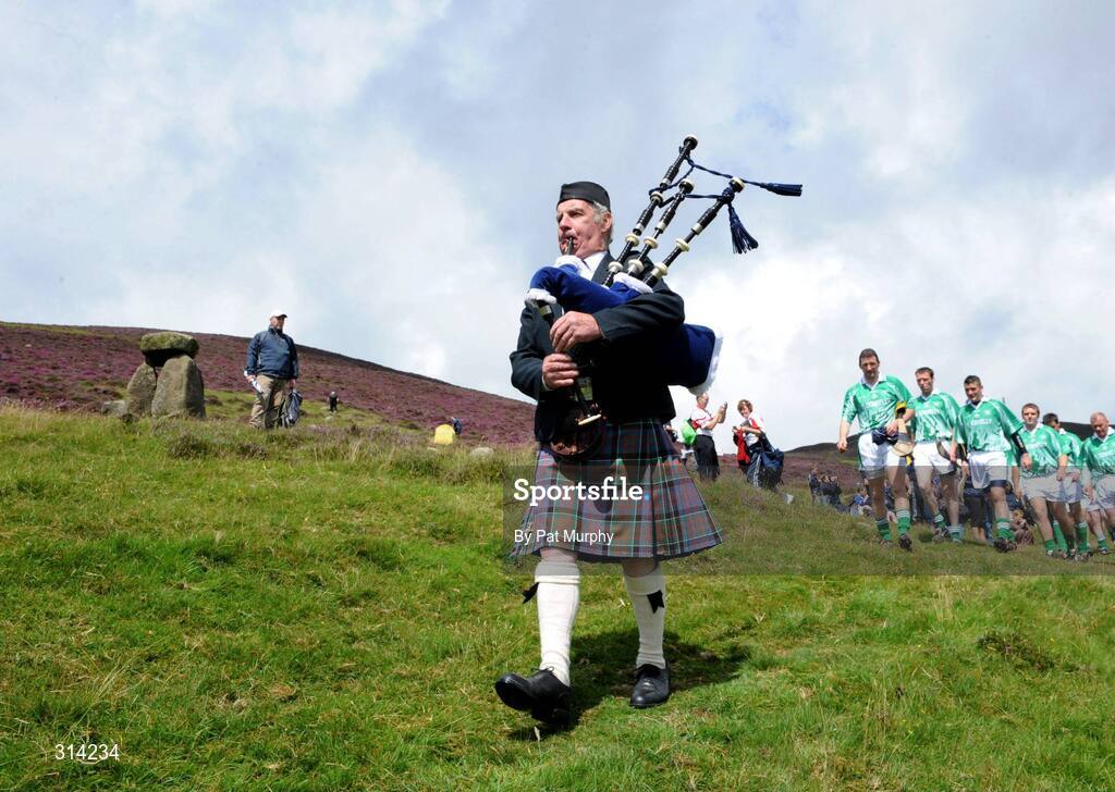 2 August 2008; Paddy the Piper leads the players to the start of the 2008 M Donnelly Poc Fada. Annaverna Mountain, Ravensdale, Co. Louth. Picture credit: Pat Murphy / SPORTSFILE