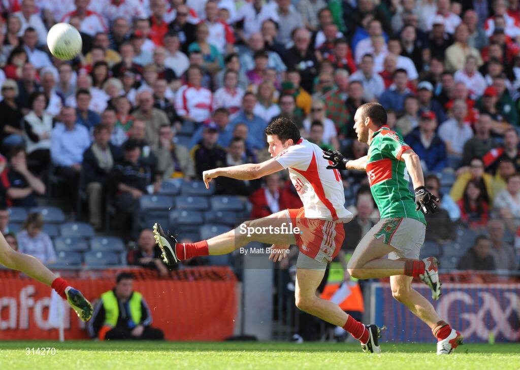 2 August 2008; Sean Cavanagh, Tyrone, kicks over a point despite Trevor Mortimer, Mayo. All-Ireland Senior Football Championship Qualifier, Round 3, Tyrone v Mayo, Croke Park, Dublin. Picture credit: Matt Browne / SPORTSFILE