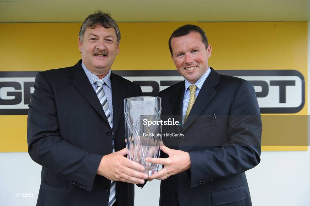 28 July 2008; Donal Duggan, GPT Dublin, presents Mark Weld with a trophy after winning the GPT Dublin Handicap Hurdle. Galway Racing Fesitval - Monday, Ballybrit, Galway. Picture credit: Stephen McCarthy / SPORTSFILE