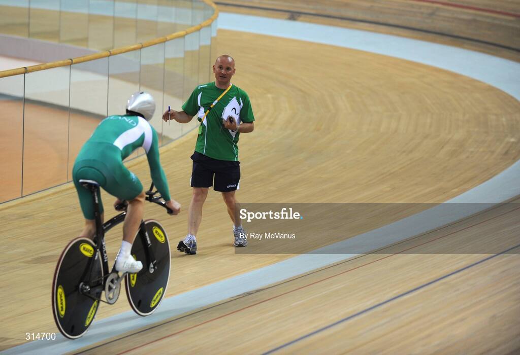6 August 2008; Coach Tommy Evans watches David O'Loughlin, from Cong, Co. Mayo, during a  training session in advance of the Games which open on Friday. Speaking after training David said " I was sixth in the World Championships, so I'd like to improve on that. My personal best for the Individual Sprint is 4:20min, and  I'd like to be down to 4:17min. I'll be a bit better, than I was at the World Championships, and I'll be happy. Beijing 2008 - Games of the XXIX Olympiad, Laoshan Velodrome, Shijingshan District, Beijing, China. Picture credit: Ray McManus / SPORTSFILE