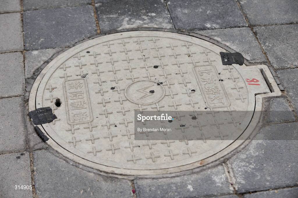 7 August 2008; A general view of a sealed manhole cover in the Olympic Green. Beijing 2008 - Games of the XXIX Olympiad, Olympic Green, Beijing, China. Picture credit: Brendan Moran / SPORTSFILE