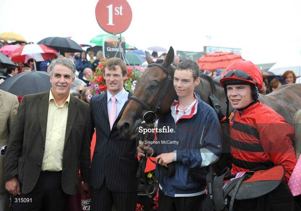31 July 2008; Jockey Denis O'Regan and winning connections after winning the St. James's Gate Novice Hurdle, onboard Define. Galway Racing Festival - Thursday, Ballybrit, Co. Galway. Picture credit: Stephen McCarthy / SPORTSFILE