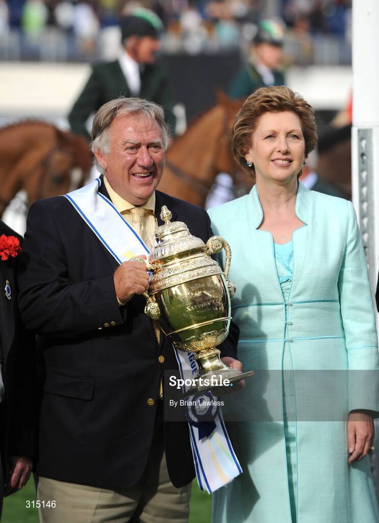 8 August 2008; Great Britain's Chef d'Equipe David Broome is presented with the Aga Khan Nations Cup by the President of Ireland Mary McAleese. Failte Ireland Dublin Horse Show 2008, The Royal Dublin Society, Ballsbridge, Dublin. Picture credit: Brian Lawless / SPORTSFILE