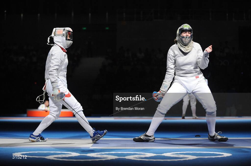9 August 2008; Siobhan Byrne, right, Ireland, celebrates winning a point against Irena Wieckowska, Poland, to whom she lost 15-8. Beijing 2008 - Games of the XXIX Olympiad, Fencing Hall of National Convention Centre, Olympic Green, Beijing, China. Picture credit: Brendan Moran / SPORTSFILE
