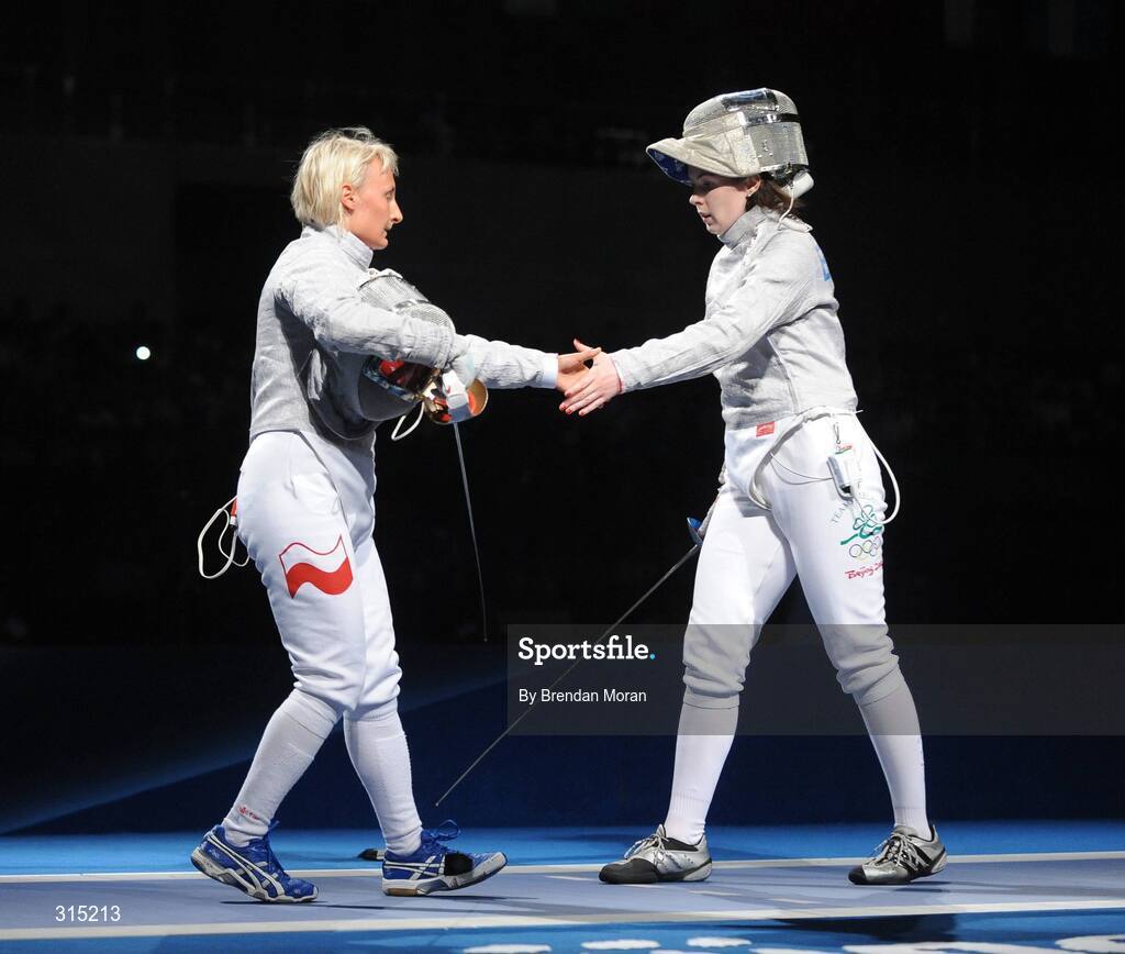 9 August 2008; Siobhan Byrne, right, Ireland, shakes hands with her victor Irena Wieckowska, Poland, to whom she lost 15-8. Beijing 2008 - Games of the XXIX Olympiad, Fencing Hall of National Convention Centre, Olympic Green, Beijing, China. Picture credit: Brendan Moran / SPORTSFILE