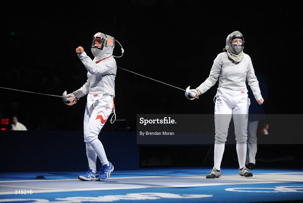 9 August 2008; Irena Wieckowska, left, Poland, celebrates winning a point against Siobhan Byrne, Ireland. Beijing 2008 - Games of the XXIX Olympiad, Fencing Hall of National Convention Centre, Olympic Green, Beijing, China. Picture credit: Brendan Moran / SPORTSFILE