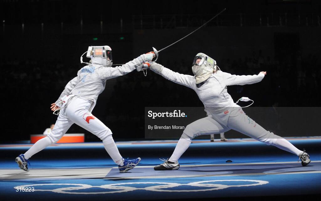9 August 2008; Siobhan Byrne, right, Ireland, scores a point against Irena Wieckowska, Poland, to whom she lost 15-8. Beijing 2008 - Games of the XXIX Olympiad, Fencing Hall of National Convention Centre, Olympic Green, Beijing, China. Picture credit: Brendan Moran / SPORTSFILE