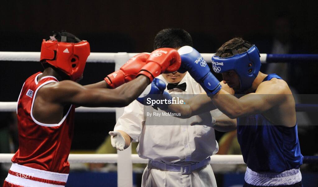 9 August 2008; Ken Egan, Ireland, and Julius Jackson, red, Virgin Islands, 'shake hands' at the start of the first round of the Light heavy weight, 81 kg, contest. Beijing 2008 - Games of the XXIX Olympiad, Beijing Workers Gymnasium, Olympic Green, Beijing, China. Picture credit: Ray McManus / SPORTSFILE