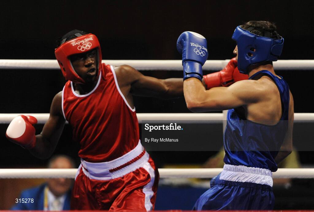 9 August 2008; Ken Egan, Ireland, avoids the left hook of Julius Jackson, red, Virgin Islands, during the first round contest in the the Light heavy weight, 81 kg, class. Beijing 2008 - Games of the XXIX Olympiad, Beijing Workers Gymnasium, Olympic Green, Beijing, China. Picture credit: Ray McManus / SPORTSFILE