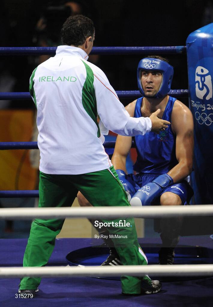 9 August 2008; Ken Egan, Ireland, who beat Julius Jackson, red, Virgin Islands, in the the first contest of the Light heavy weight, 81 kg, class listens to coach Billy Walsh during rounds. Beijing 2008 - Games of the XXIX Olympiad, Beijing Workers Gymnasium, Olympic Green, Beijing, China. Picture credit: Ray McManus / SPORTSFILE
