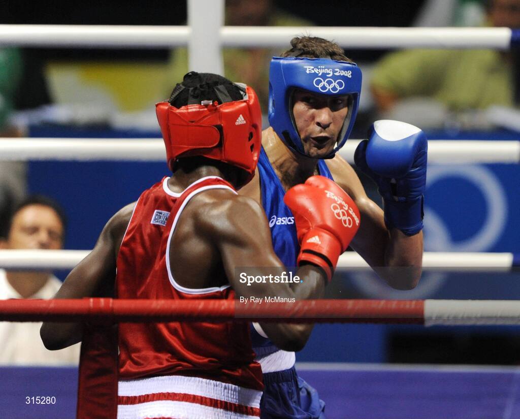 9 August 2008; Ken Egan, Ireland, in action against Julius Jackson, red, Virgin Islands, during the first round of the Light heavy weight, 81 kg, contest. Beijing 2008 - Games of the XXIX Olympiad, Beijing Workers Gymnasium, Olympic Green, Beijing, China. Picture credit: Ray McManus / SPORTSFILE
