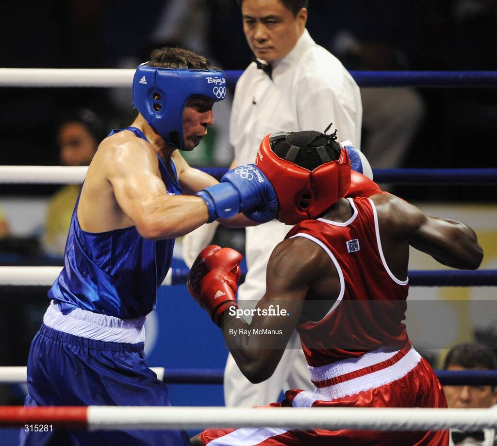 9 August 2008; Ken Egan, Ireland, in action against Julius Jackson, red, Virgin Islands, during the first round of the Light heavy weight, 81 kg, contest. Beijing 2008 - Games of the XXIX Olympiad, Beijing Workers Gymnasium, Olympic Green, Beijing, China. Picture credit: Ray McManus / SPORTSFILE