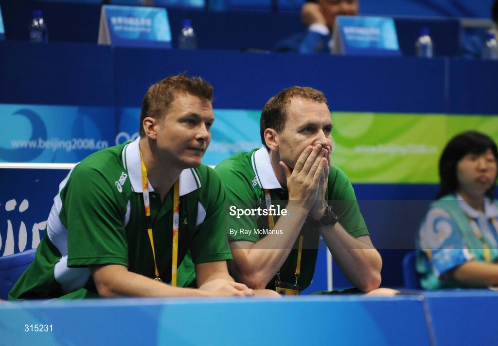 9 August 2008; Team manager Donal O'Halloran, right, and team coach Jim Laugenson watch on anxiously as Scott Evans, Ireland, plays his first round game against Marc Zwiebler, Germany. Beijing 2008 - Games of the XXIX Olympiad, Beijing University of Technology Gymnasium, Beijing, China. Picture credit: Ray McManus / SPORTSFILE
