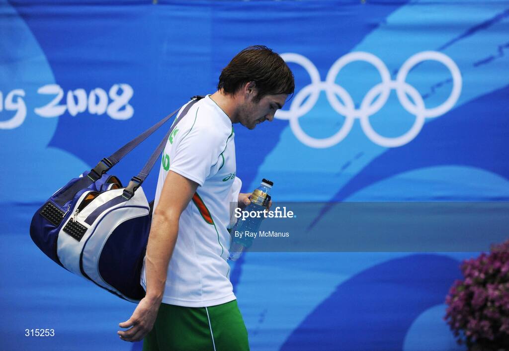 9 August 2008; A dejected Scott Evans, Ireland, leaves the court after loosing his the first round game against Marc Zwiebler, Germany. Beijing 2008 - Games of the XXIX Olympiad, Beijing University of Technology Gymnasium, Beijing, China. Picture credit: Ray McManus / SPORTSFILE
