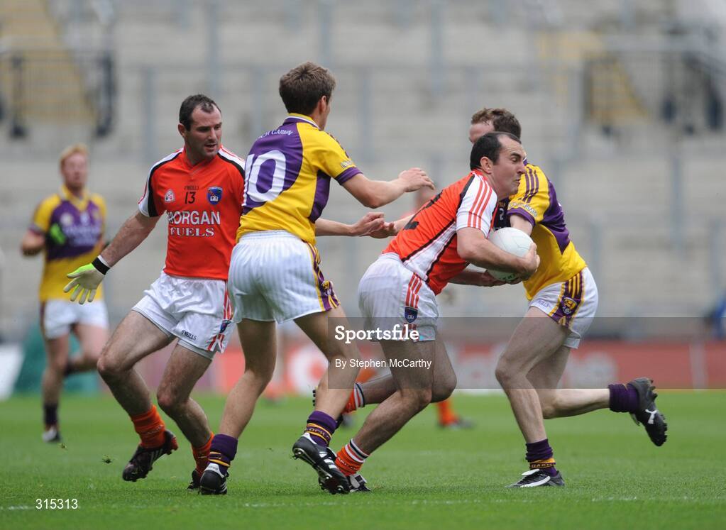 9 August 2008; Martin O'Rourke, Armagh, in action against David Walsh, right, and Redmond Barry, Wexford. GAA Football All-Ireland Senior Championship Quarter-Final, Armagh v Wexford, Croke Park, Dublin. Picture credit: Stephen McCarthy / SPORTSFILE