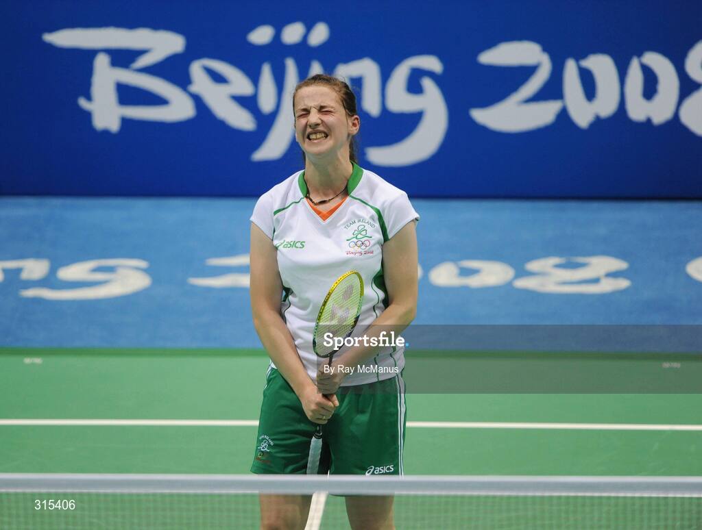 9 August 2008; Chloe Magee, Ireland, feels the pain of droppinng a shot during her first round game against Kati Tolmoff, Estonia. Magee eventually won 18-21, 21-18, 21-19. Beijing 2008 - Games of the XXIX Olympiad, Beijing University of Technology Gymnasium, Beijing, China. Picture credit: Ray McManus / SPORTSFILE