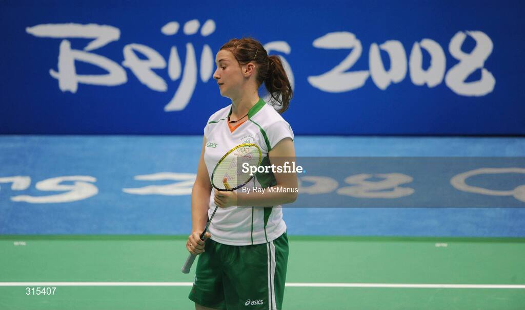 9 August 2008; Chloe Magee, Ireland, feels the pain of droppinng a shot during her first round game against Kati Tolmoff, Estonia. Magee eventually won 18-21, 21-18, 21-19. Beijing 2008 - Games of the XXIX Olympiad, Beijing University of Technology Gymnasium, Beijing, China. Picture credit: Ray McManus / SPORTSFILE