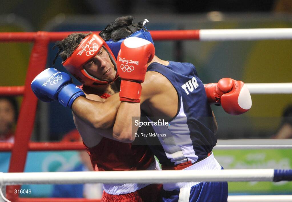 14 August 2008; Kenny Egan, Ireland, in action against Bahram Muzaffer, Turkey, in the blue vest, during the 'round of 16' Light heavy weight, 81 kg, contest. Egan won 10pts to 2. Beijing 2008 - Games of the XXIX Olympiad, Beijing Workers Gymnasium, Olympic Green, Beijing, China. Picture credit: Ray McManus / SPORTSFILE