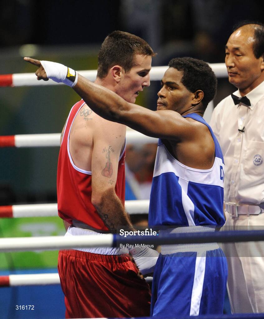 14 August 2008; Ireland's John Joe Joyce shows his disappointment as Felix Diaz, of the Dominican Republic celebrates after victory in the 'round of 16' Light welter weight, 64 kg, contest. Beijing 2008 - Games of the XXIX Olympiad, Beijing Workers Gymnasium, Olympic Green, Beijing, China. Picture credit: Ray McManus / SPORTSFILE