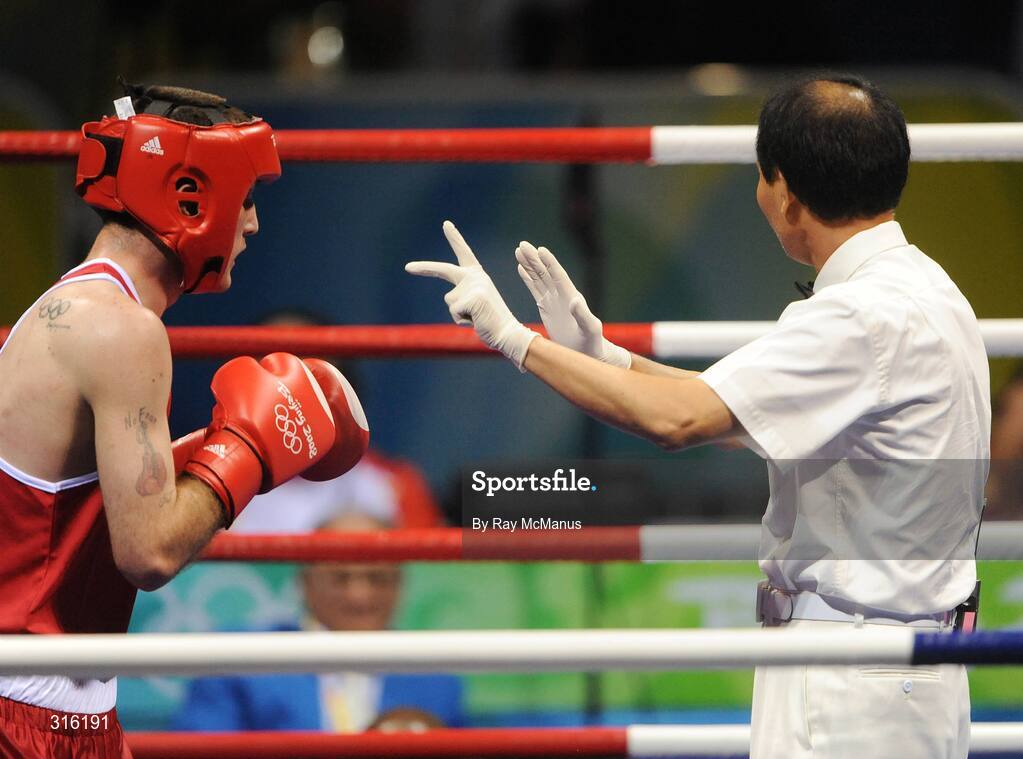 14 August 2008; John Joe Joyce, Ireland, takes a standing count of eight during the third round of the 'round of 16' Light welter weight, 64 kg, contest. Beijing 2008 - Games of the XXIX Olympiad, Beijing Workers Gymnasium, Olympic Green, Beijing, China. Picture credit: Ray McManus / SPORTSFILE