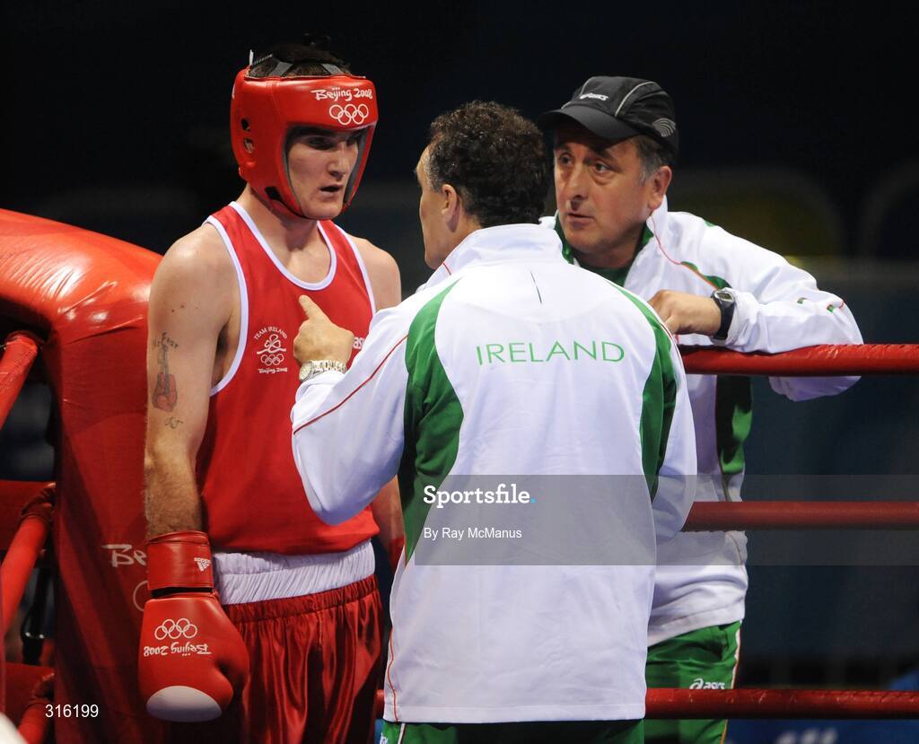 14 August 2008; John Joe Joyce, Ireland, listens to advise from head coach Billy Walsh and technical coach Zaur Antia during rounds of his bout with Felix Diaz, Dominican Republic, during the 'round of 16' Light welter weight, 64 kg, contest. Beijing 2008 - Games of the XXIX Olympiad, Beijing Workers Gymnasium, Olympic Green, Beijing, China. Picture credit: Ray McManus / SPORTSFILE