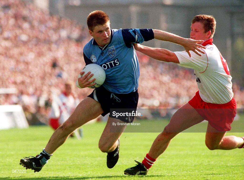 17 September 1995; Dessie Farrell of Dublin is tackled by Seamus McCallan of Tyrone during the All Ireland Football Final match between Dublin and Tyrone at Croke Park in Dublin. Picture Credit: Brendan Moran/SPORTSFILE