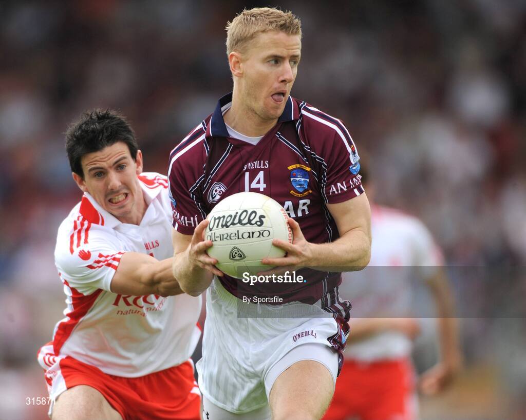 26 July 2008; Denis Glennon, Westmeath, in action against P.J. Quinn, Tyrone. GAA Football All-Ireland Senior Championship Qualifier - Rd 2, Tyrone v Westmeath, Healy Park, Omagh, Co. Tyrone. Photo by Sportsfile