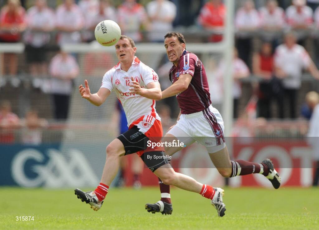 26 July 2008; Tommy McGuigan, Tyrone, in action against Damien Healy, Westmeath. GAA Football All-Ireland Senior Championship Qualifier - Rd 2, Tyrone v Westmeath, Healy Park, Omagh, Co. Tyrone. Photo by Sportsfile