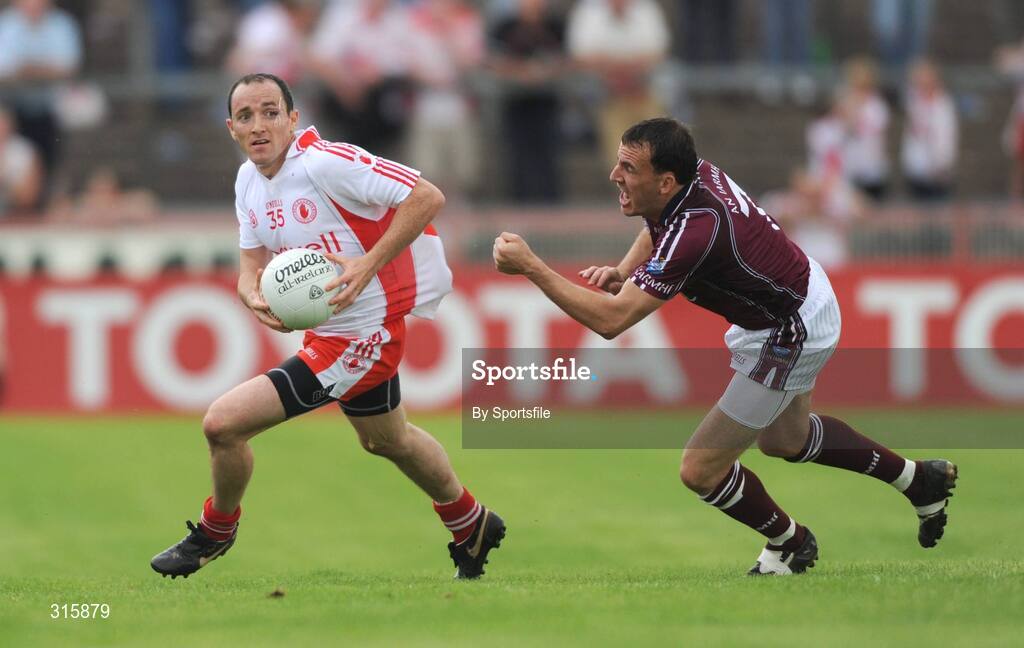 26 July 2008; Brian Dooher, Tyrone, in action against Damien Healy, Westmeath. GAA Football All-Ireland Senior Championship Qualifier - Rd 2, Tyrone v Westmeath, Healy Park, Omagh, Co. Tyrone. Photo by Sportsfile