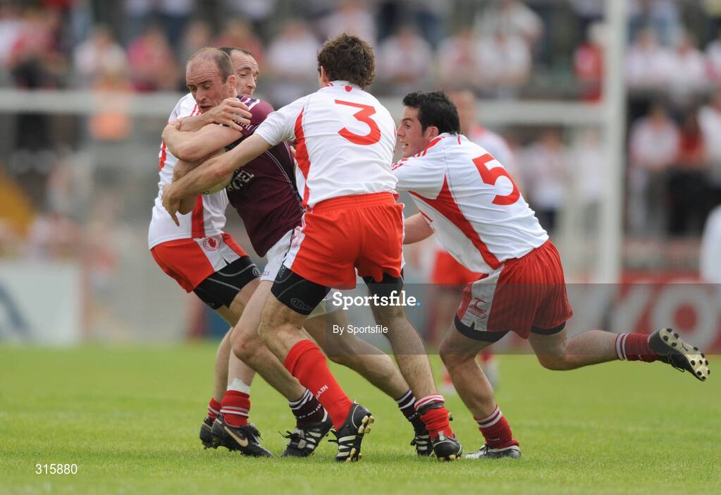 26 July 2008; John Smyth, Westmeath, in action against Brian Dooher, left, Justin McMahon and Davy Harte, right, Tyrone. GAA Football All-Ireland Senior Championship Qualifier - Rd 2, Tyrone v Westmeath, Healy Park, Omagh, Co. Tyrone. Photo by Sportsfile