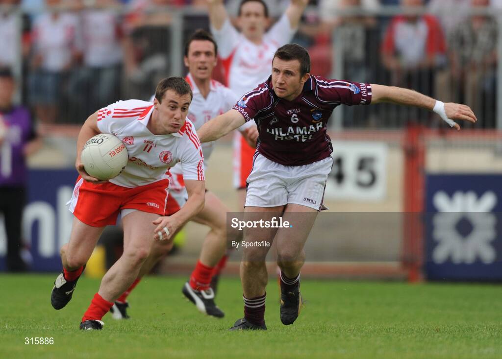 26 July 2008; Brian McGuigan, Tyrone, in action against Derek Heavin, Westmeath. GAA Football All-Ireland Senior Championship Qualifier - Rd 2, Tyrone v Westmeath, Healy Park, Omagh, Co. Tyrone. Photo by Sportsfile
