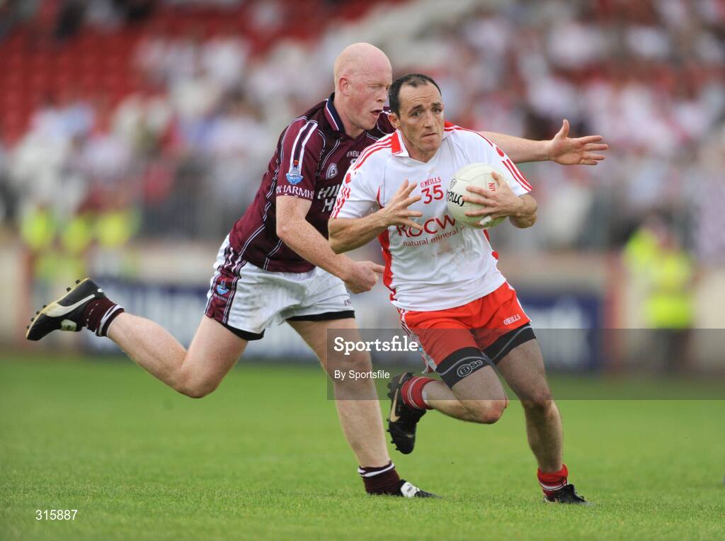 26 July 2008; Brian Dooher, Tyrone, in action against Donal O'Donoghue, Westmeath. GAA Football All-Ireland Senior Championship Qualifier - Rd 2, Tyrone v Westmeath, Healy Park, Omagh, Co. Tyrone. Photo by Sportsfile