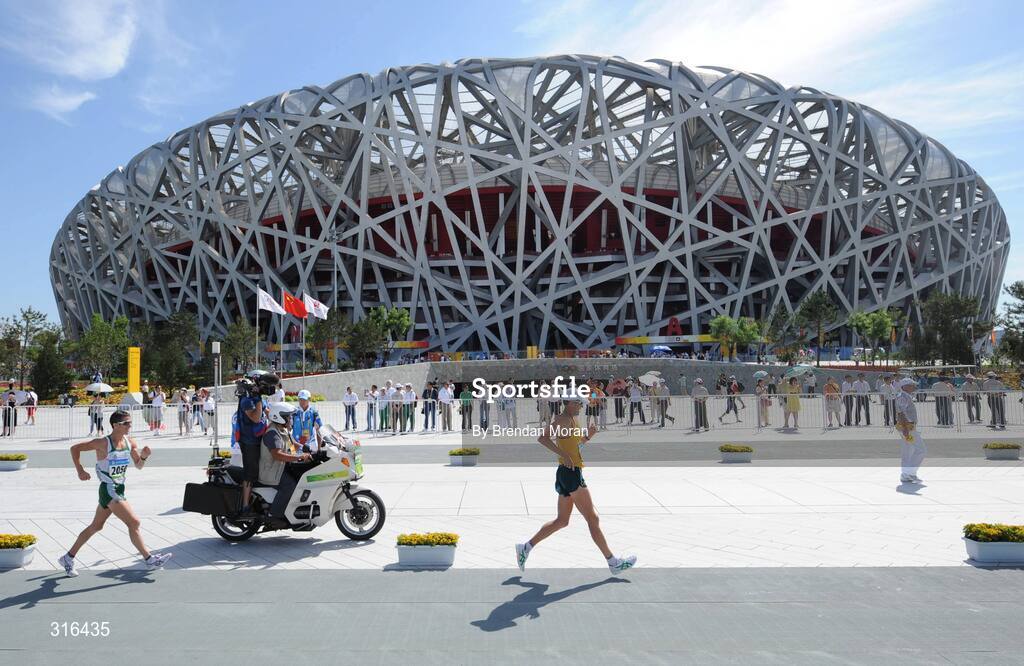 16 August 2008; Robert Heffernan, 2050, Ireland, follows Luke Adams, of Australia, past the Natinal Stadium, during the Men's 20km Walk Final, in which he finished in 8th place in a time of 1.20.36. Beijing 2008 - Games of the XXIX Olympiad, National Stadium, Olympic Green, Beijing, China. Picture credit: Brendan Moran / SPORTSFILE