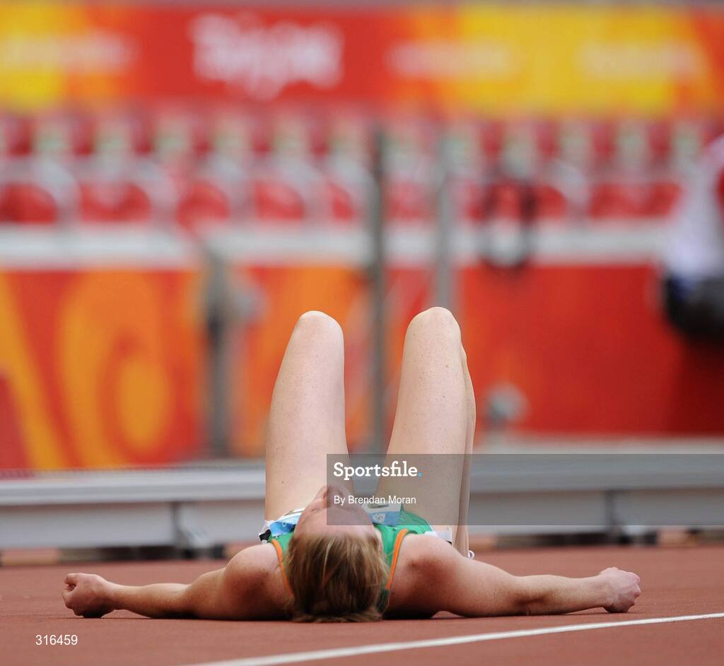 16 August 2008; Joanne Cuddihy, Ireland, lies on the track after her heat of the Women's 400m, in which she finished 6th in a time of 53.32. Beijing 2008 - Games of the XXIX Olympiad, National Stadium, Olympic Green, Beijing, China. Picture credit: Brendan Moran / SPORTSFILE