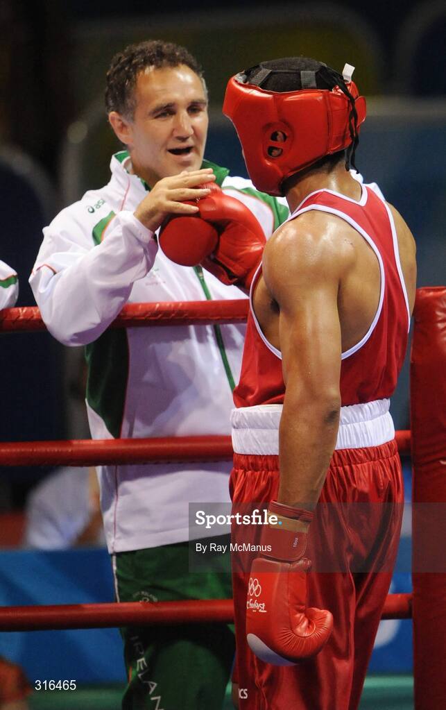 16 August 2008; Darren Sutherland, Ireland, celebrates victory over Nabil Kassel, from Algeria, with coach Billy Walsh during the 'round of 16' Middle weight, 75kg, contest. Beijing 2008 - Games of the XXIX Olympiad, Beijing Workers Gymnasium, Olympic Green, Beijing, China. Picture credit: Ray McManus / SPORTSFILE