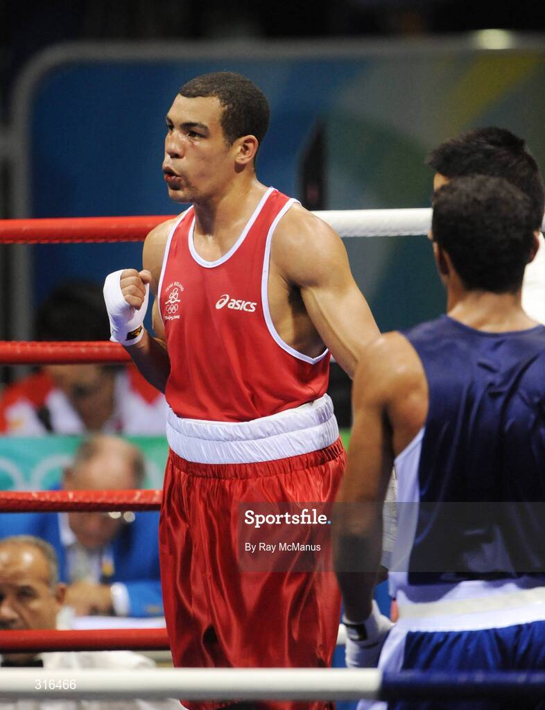 16 August 2008; Darren Sutherland, Ireland, celebrates victory over Nabil Kassel, from Algeria, during the 'round of 16' Middle weight, 75kg, contest. Beijing 2008 - Games of the XXIX Olympiad, Beijing Workers Gymnasium, Olympic Green, Beijing, China. Picture credit: Ray McManus / SPORTSFILE