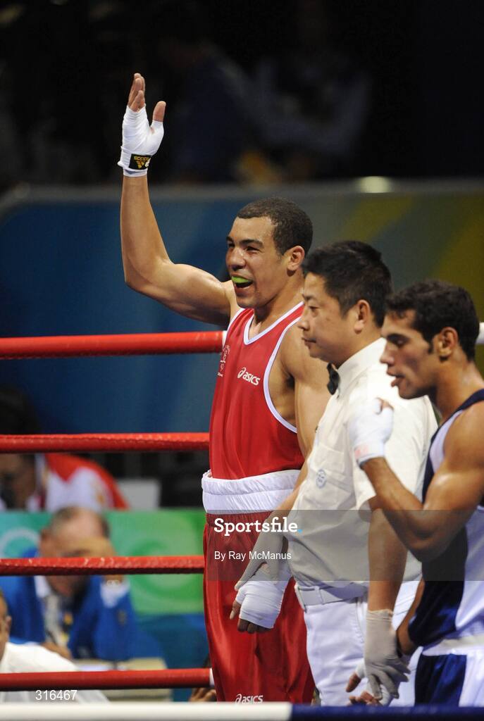 16 August 2008; Darren Sutherland, Ireland, celebrates victory over Nabil Kassel, from Algeria, during the 'round of 16' Middle weight, 75kg, contest. Beijing 2008 - Games of the XXIX Olympiad, Beijing Workers Gymnasium, Olympic Green, Beijing, China. Picture credit: Ray McManus / SPORTSFILE
