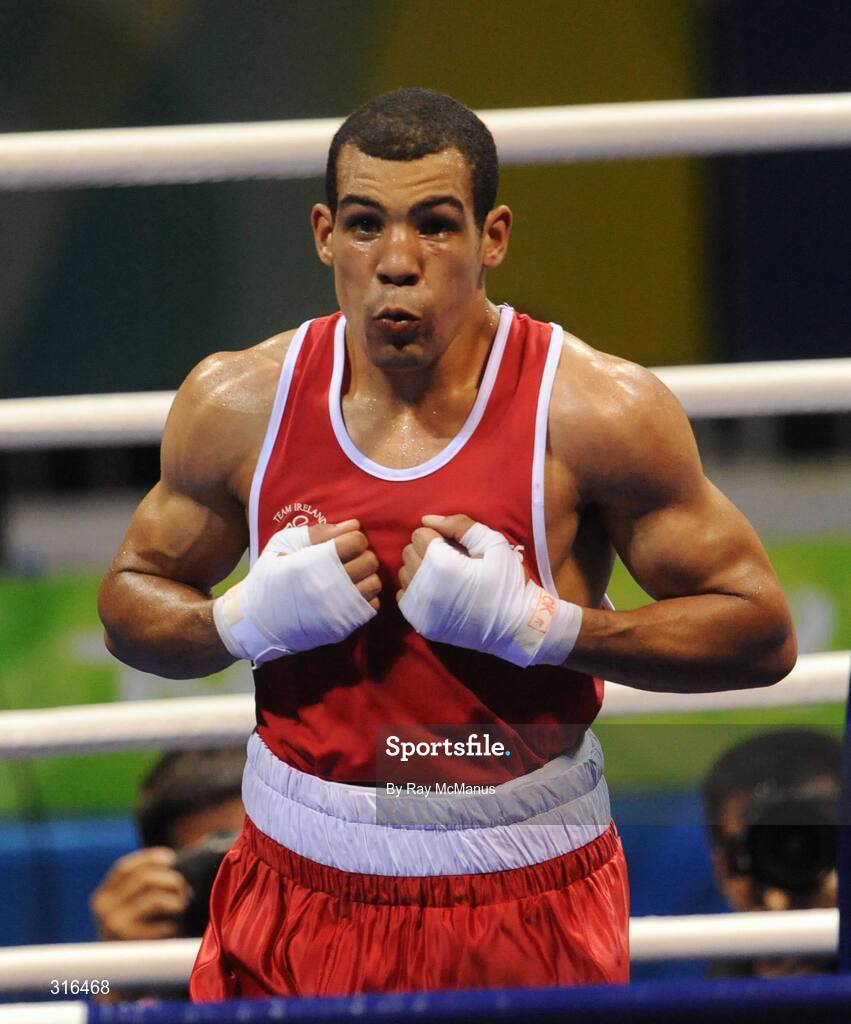16 August 2008; Darren Sutherland, Ireland, celebrates victory over Nabil Kassel, from Algeria, during the 'round of 16' Middle weight, 75kg, contest. Beijing 2008 - Games of the XXIX Olympiad, Beijing Workers Gymnasium, Olympic Green, Beijing, China. Picture credit: Ray McManus / SPORTSFILE