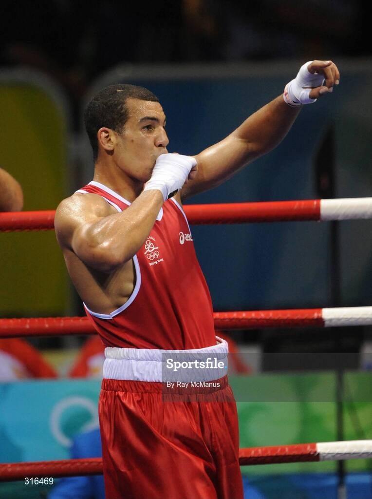 16 August 2008; Darren Sutherland, Ireland, celebrates victory over Nabil Kassel, from Algeria, during the 'round of 16' Middle weight, 75kg, contest. Beijing 2008 - Games of the XXIX Olympiad, Beijing Workers Gymnasium, Olympic Green, Beijing, China. Picture credit: Ray McManus / SPORTSFILE