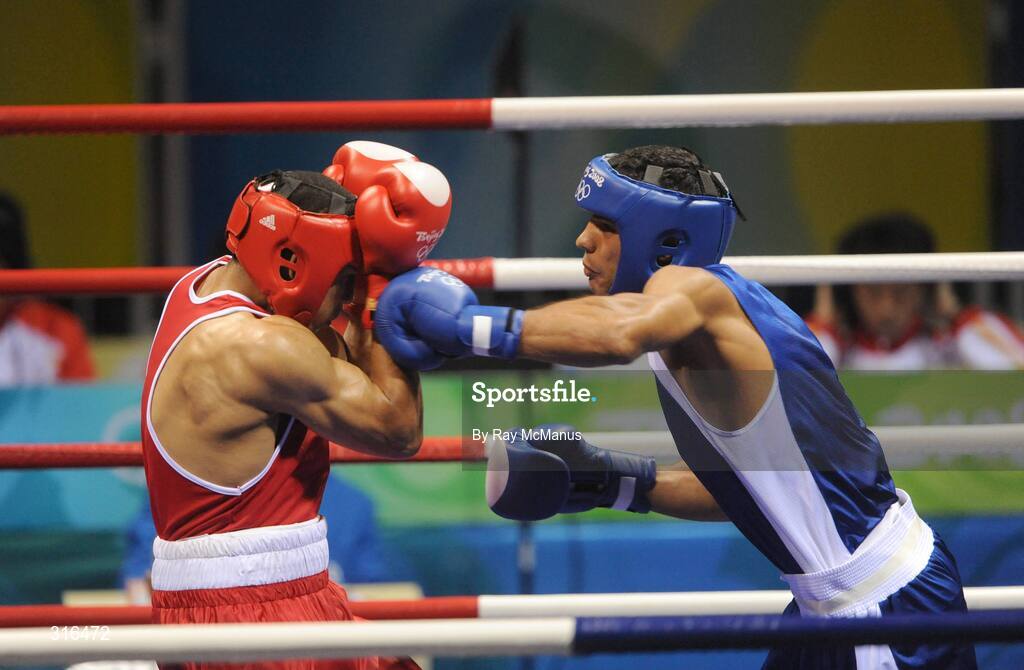 16 August 2008; Darren Sutherland, Ireland, protects himself from a left cross during his 'round of 16' Middle weight, 75kg, contest with Nabil Kassel, of Algeria. Beijing 2008 - Games of the XXIX Olympiad, Beijing Workers Gymnasium, Olympic Green, Beijing, China. Picture credit: Ray McManus / SPORTSFILE