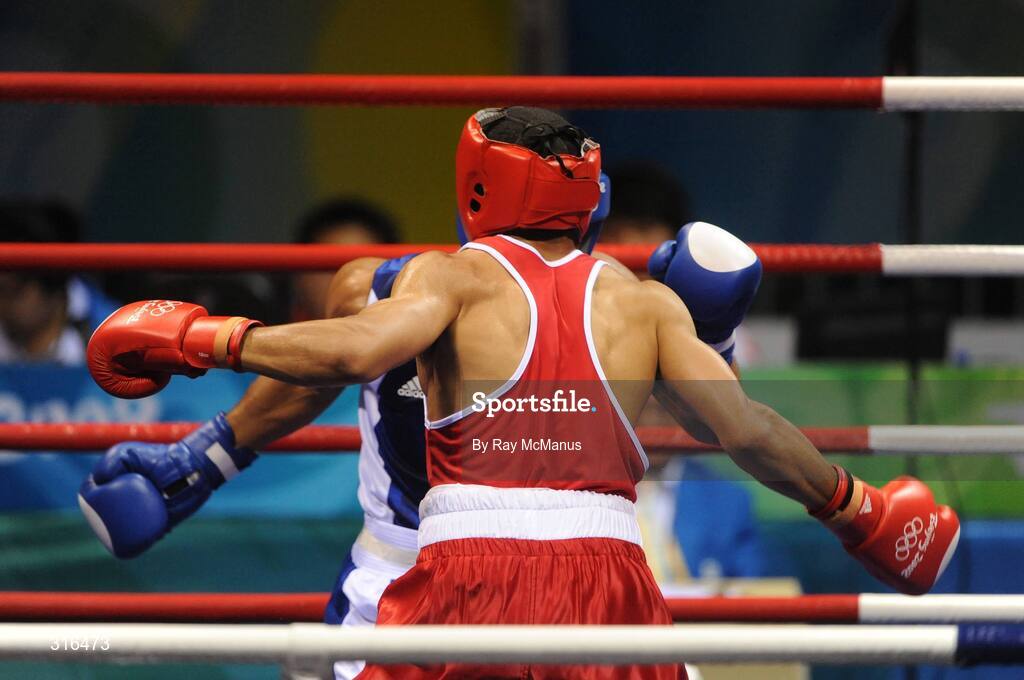 16 August 2008; Darren Sutherland, Ireland, in action against Nabil Kassel, from Algeria, during the 'round of 16' Middle weight, 75kg, contest. Beijing 2008 - Games of the XXIX Olympiad, Beijing Workers Gymnasium, Olympic Green, Beijing, China. Picture credit: Ray McManus / SPORTSFILE