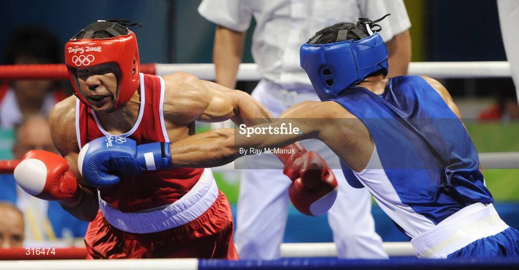 16 August 2008; Darren Sutherland, Ireland, in action against Nabil Kassel, from Algeria, during the 'round of 16' Middle weight, 75kg, contest. Beijing 2008 - Games of the XXIX Olympiad, Beijing Workers Gymnasium, Olympic Green, Beijing, China. Picture credit: Ray McManus / SPORTSFILE