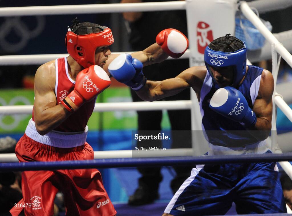 16 August 2008; Darren Sutherland, Ireland, in action against Nabil Kassel, from Algeria, during the 'round of 16' Middle weight, 75kg, contest. Beijing 2008 - Games of the XXIX Olympiad, Beijing Workers Gymnasium, Olympic Green, Beijing, China. Picture credit: Ray McManus / SPORTSFILE