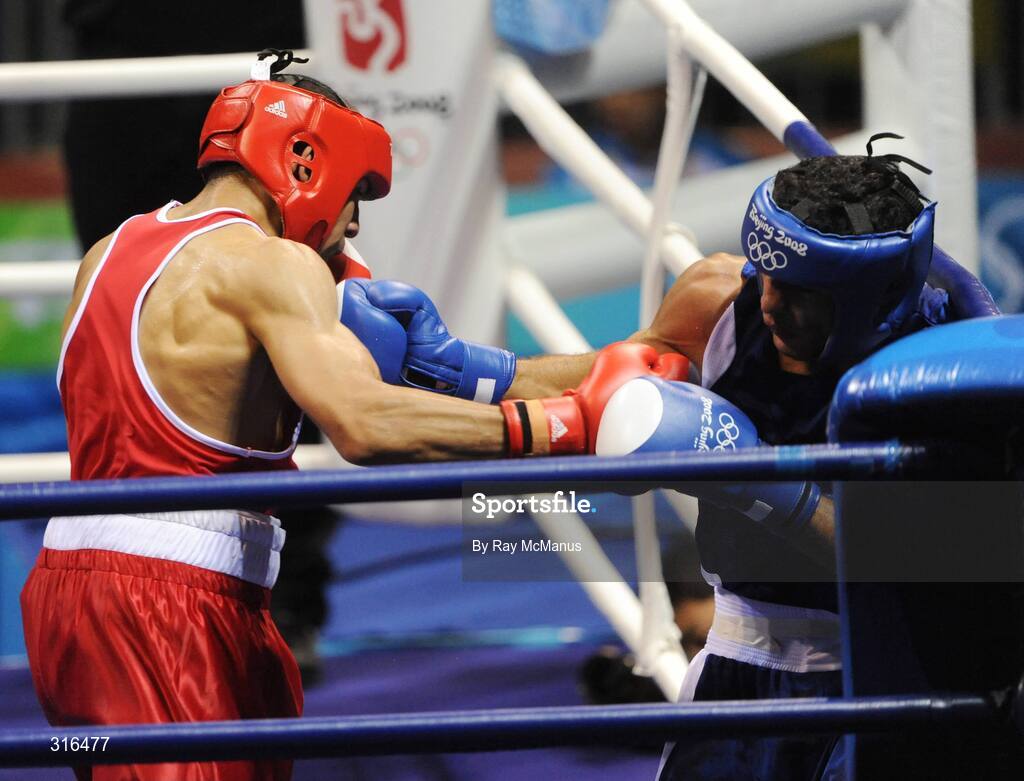 16 August 2008; Darren Sutherland, Ireland, in action against Nabil Kassel, from Algeria, during the 'round of 16' Middle weight, 75kg, contest. Beijing 2008 - Games of the XXIX Olympiad, Beijing Workers Gymnasium, Olympic Green, Beijing, China. Picture credit: Ray McManus / SPORTSFILE