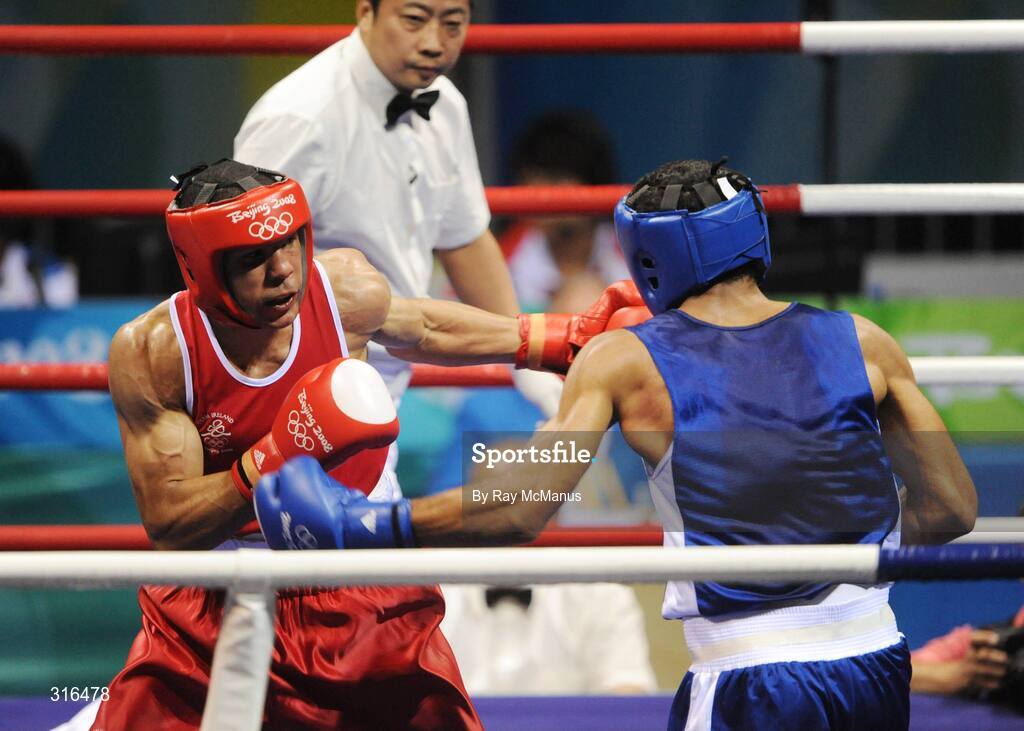 16 August 2008; Darren Sutherland, Ireland, in action against Nabil Kassel, from Algeria, during the 'round of 16' Middle weight, 75kg, contest. Beijing 2008 - Games of the XXIX Olympiad, Beijing Workers Gymnasium, Olympic Green, Beijing, China. Picture credit: Ray McManus / SPORTSFILE