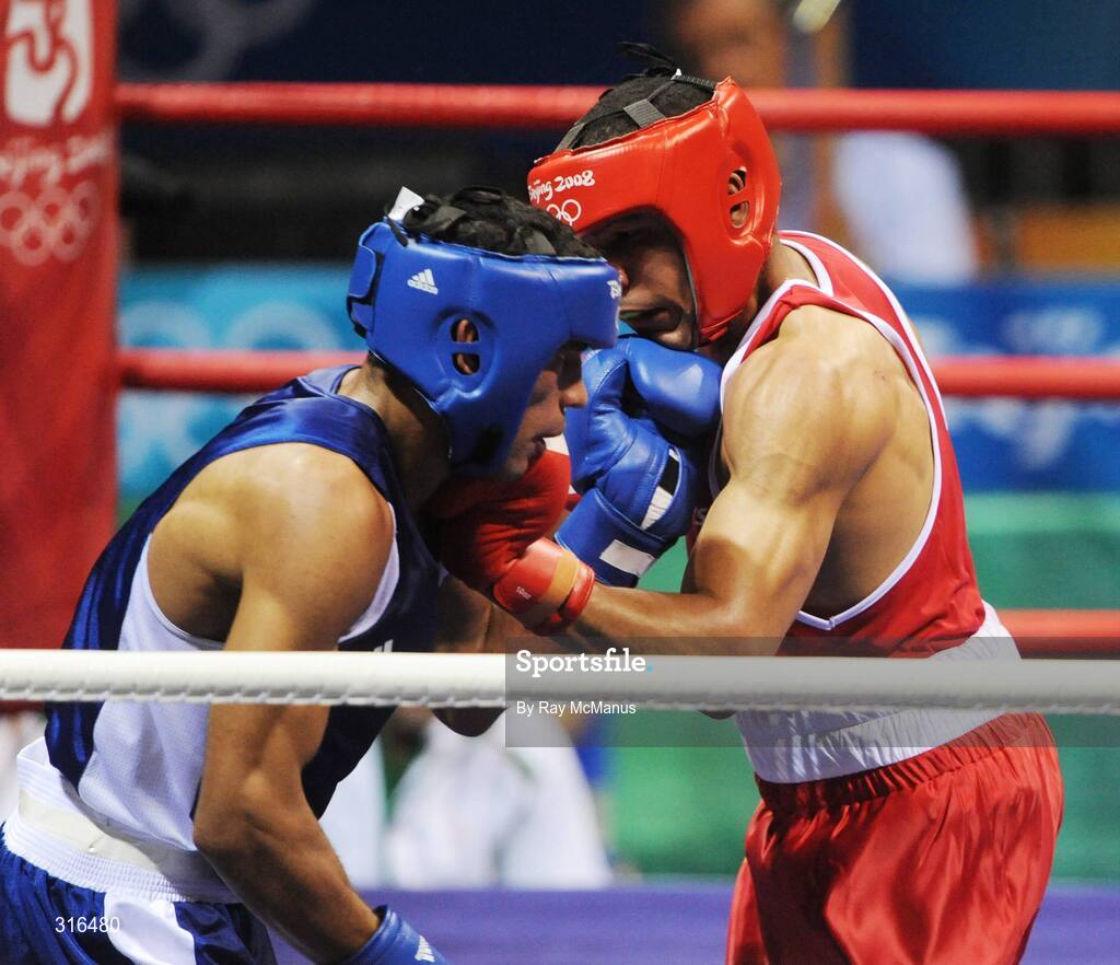 16 August 2008; Darren Sutherland, Ireland, in action against Nabil Kassel, from Algeria, during the 'round of 16' Middle weight, 75kg, contest. Beijing 2008 - Games of the XXIX Olympiad, Beijing Workers Gymnasium, Olympic Green, Beijing, China. Picture credit: Ray McManus / SPORTSFILE